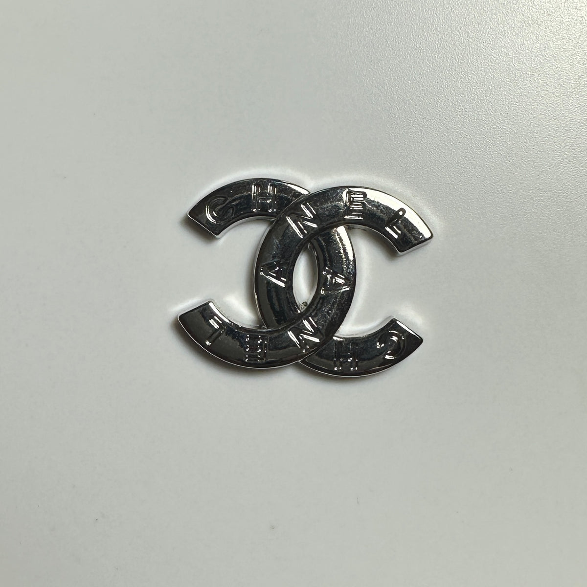 CC Silver Round With Letters On Top